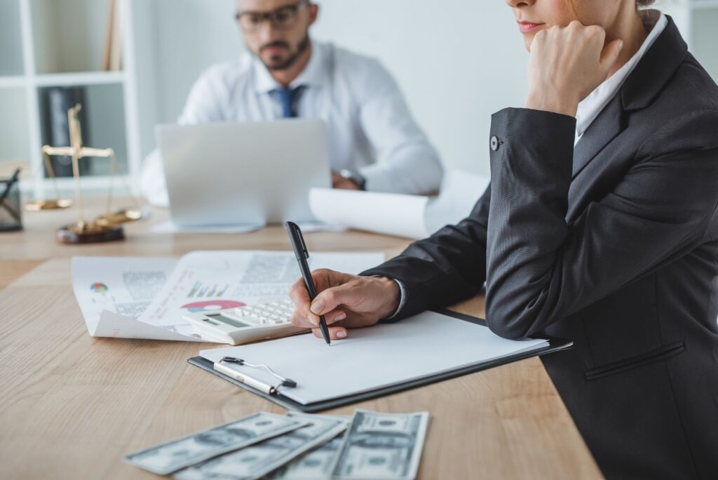 financiers sitting at table