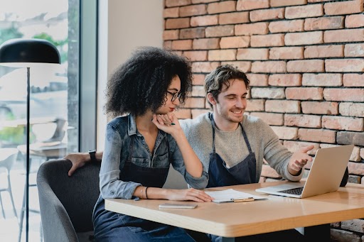 two workers worked on laptop