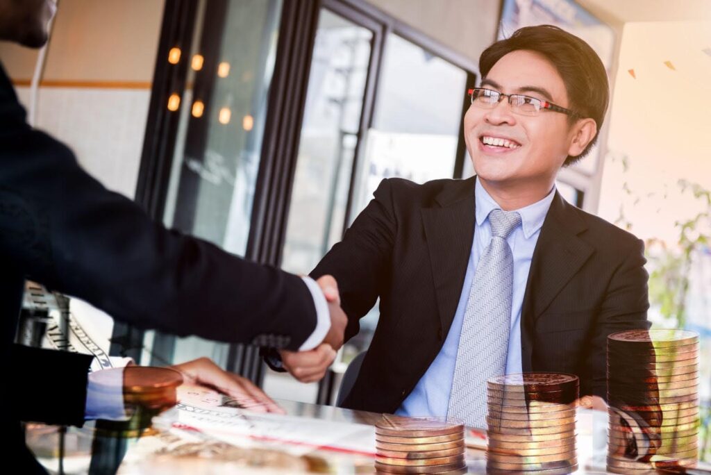 two businessman shaking hands