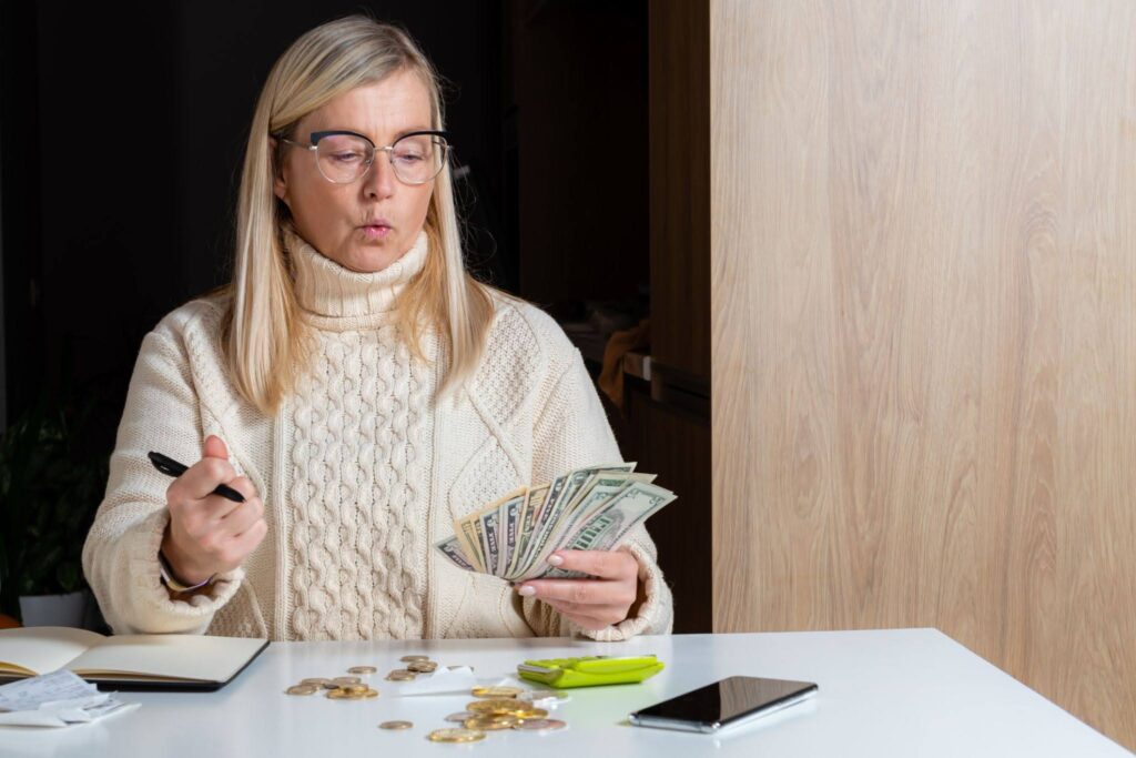 women counting dollars