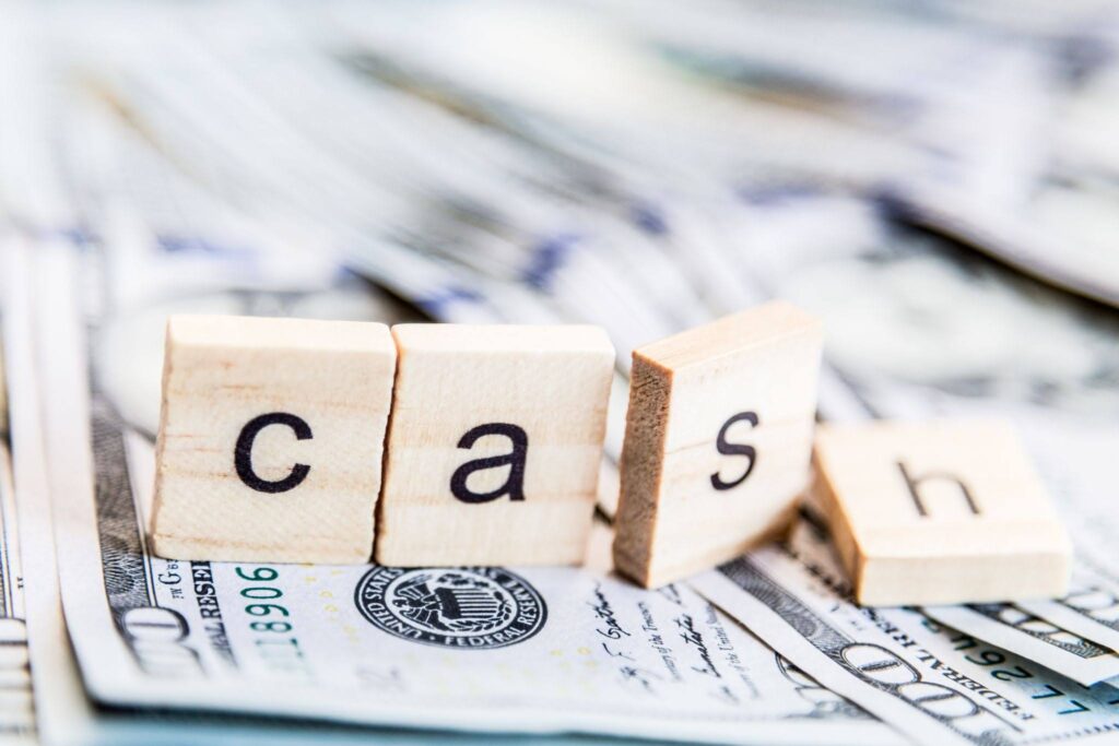 cash written blocks on money