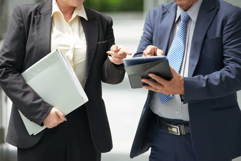 business-professionals-discussing-data-on-tablet