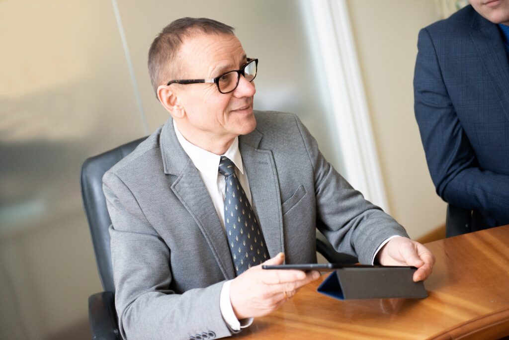 mature man working with tablet
