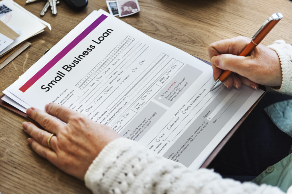 signing a small business loan application