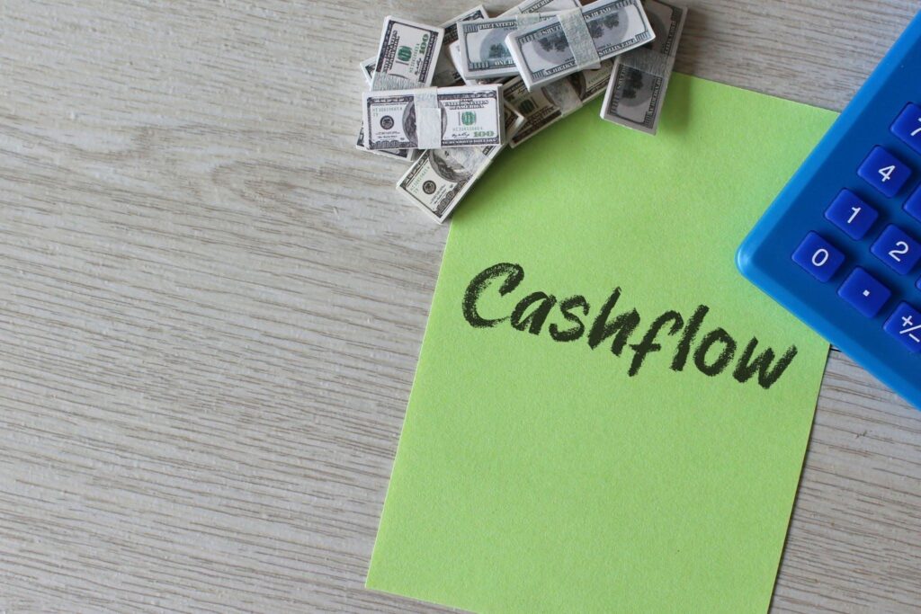 Cashflow Concept with Calculator and Bundles of Cash