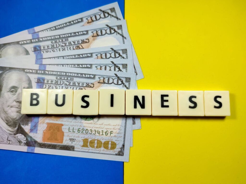 Financial Business Concept with Money and Letter Tiles