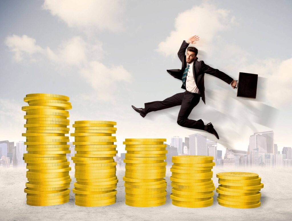 Increase In Profits Concept With Businessman Climbs The Stairs Of Gold Coins