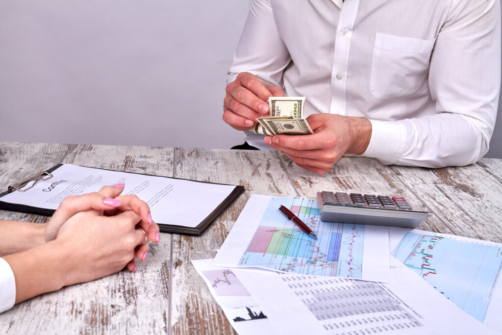 Businessman's counting money after having a deal. Profitable business partnership.