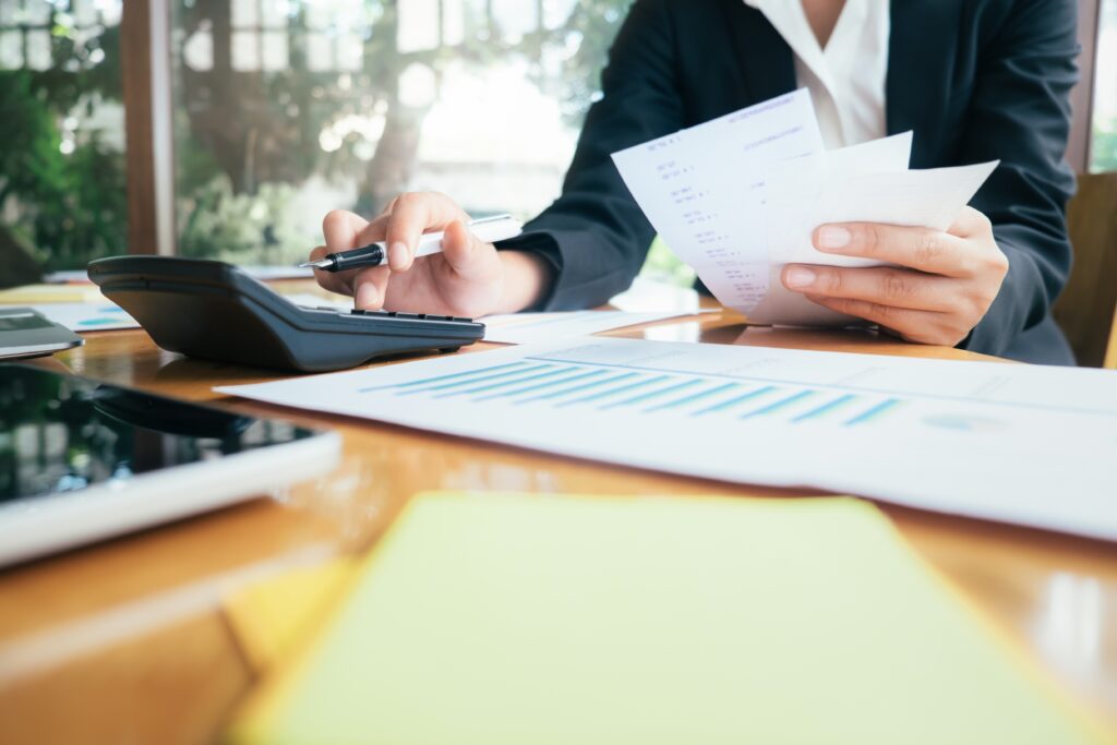 Finances Saving Economy concept. Accountant or banker calculate the cash bill.