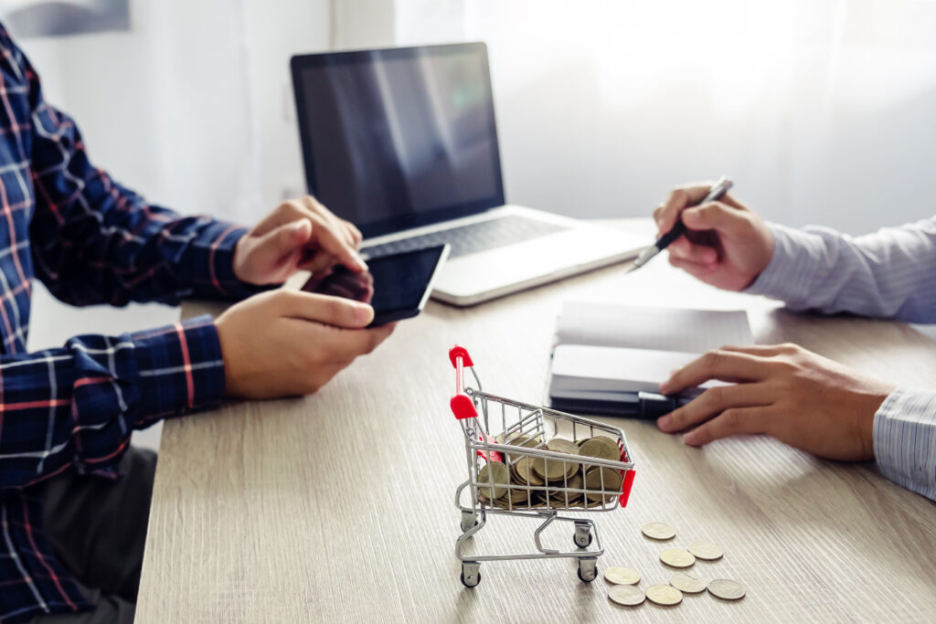 financial planning with coins laptop and mobile