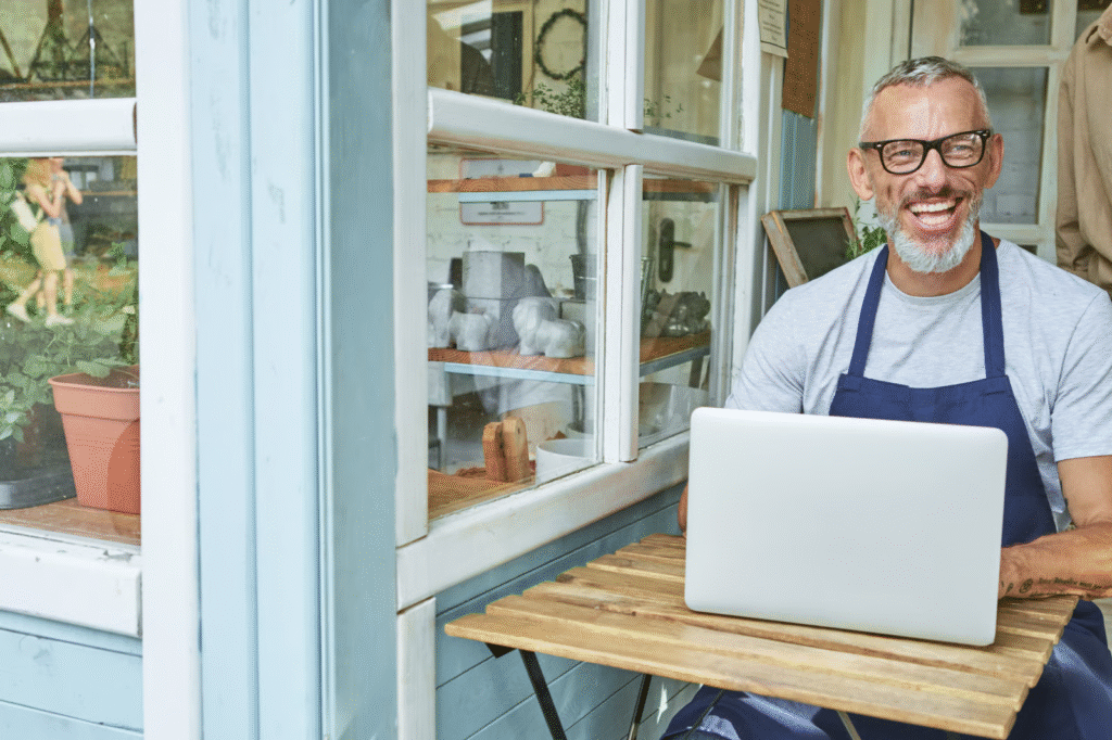 Man Running Shop Business Using Laptop