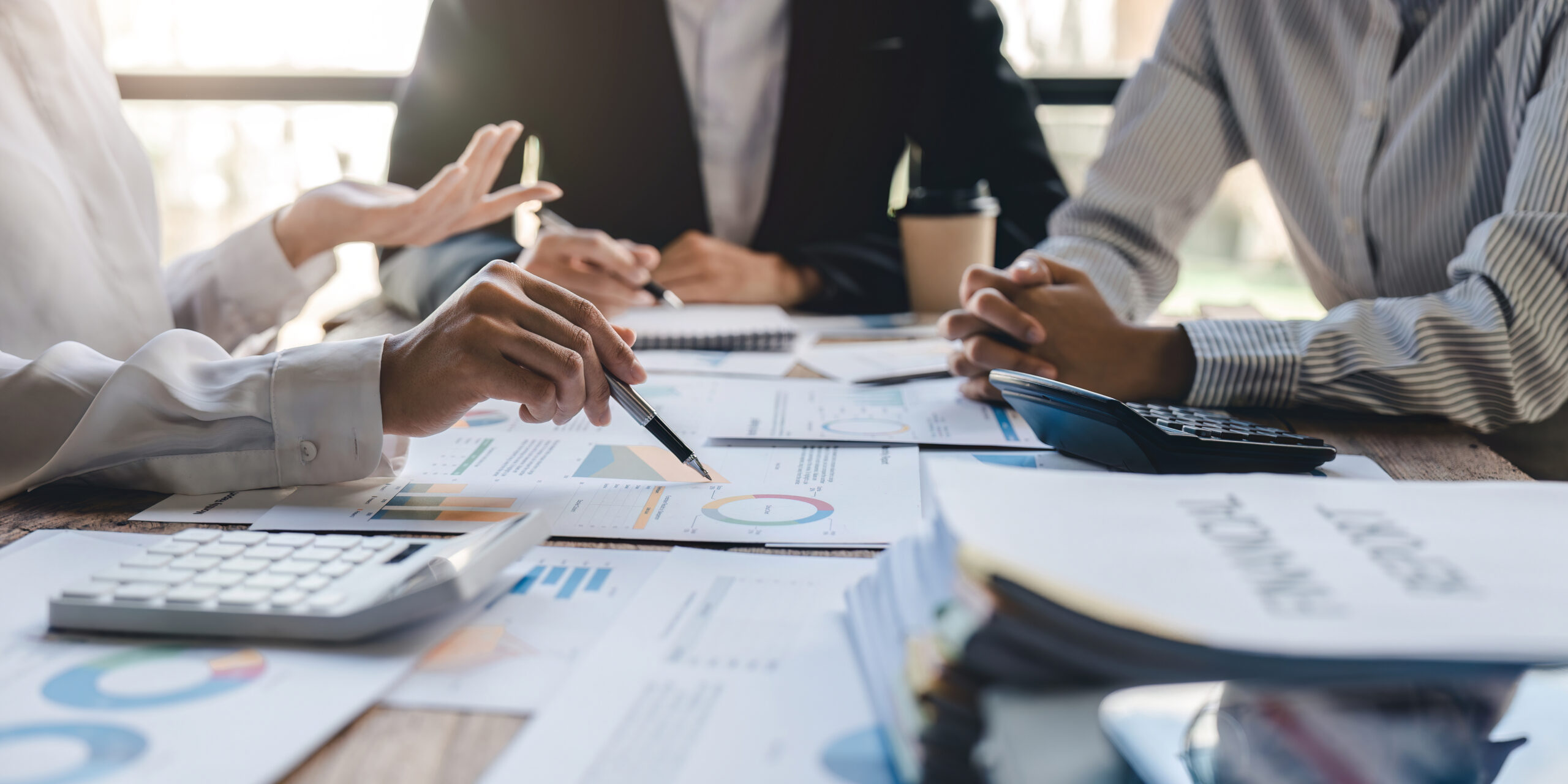 business adviser meeting to analyze and discuss the situation on the financial report in the meeting room.Investment Consultant, Financial advisor and accounting concept